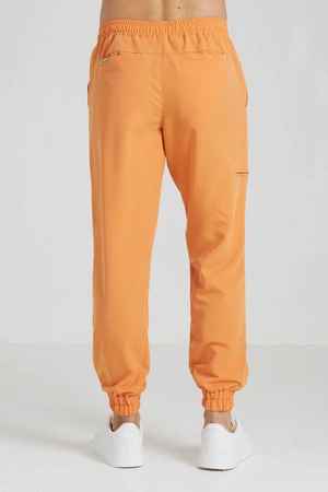 Spodnie medyczne joggery męskie - Sokrates - Tangerine